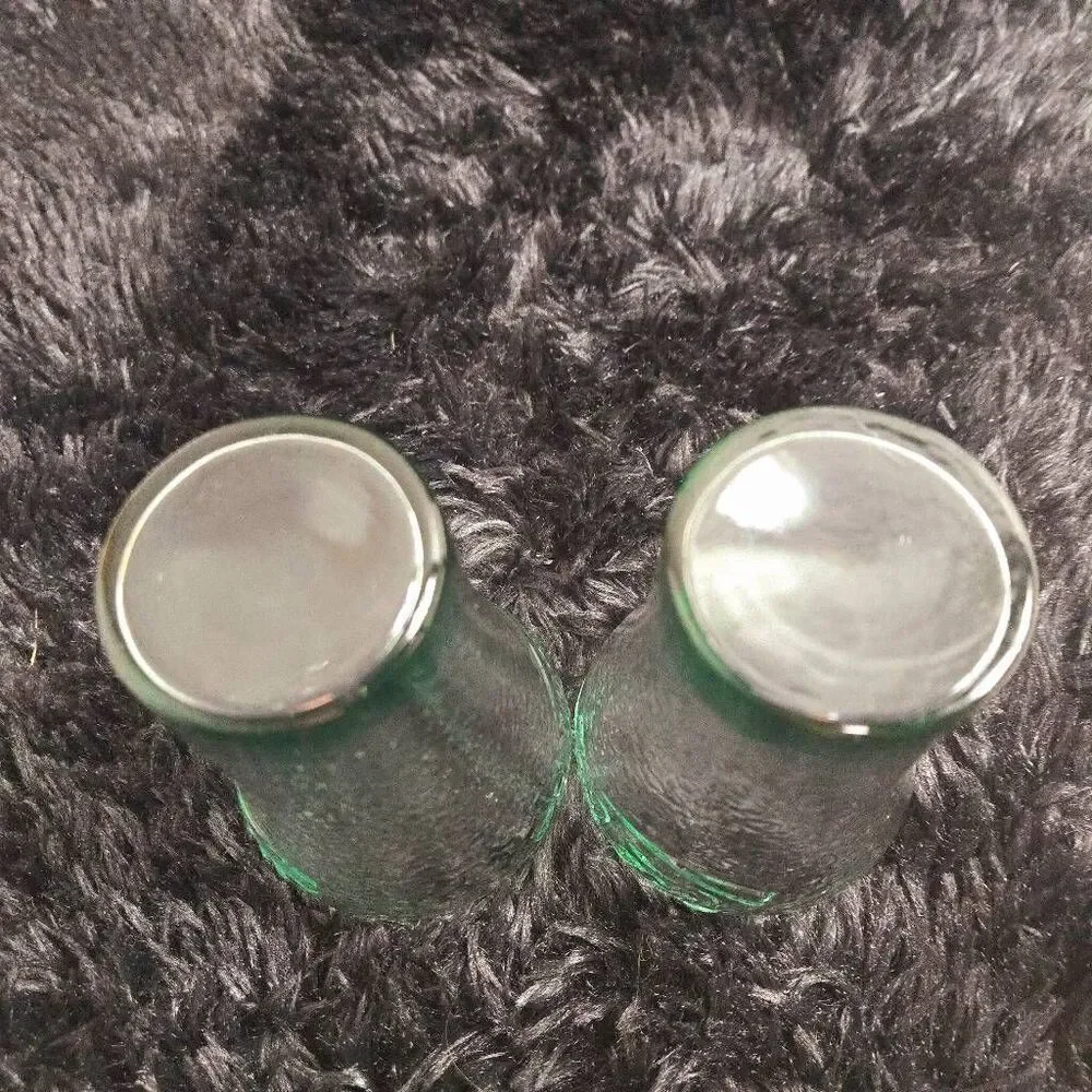 2 vintage Coca-Cola glasses with a green tint and a textured surface, often call